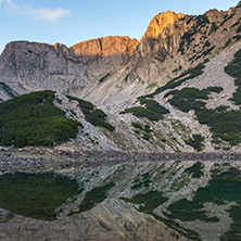 Sunrise with red rocks of Sinanitsa peak and  the lake, Pirin Mountain, Bulgaria