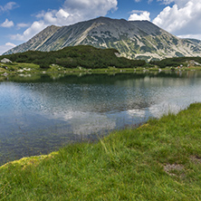Panorama with Todorka Peak and reflection in Muratovo lake, Pirin Mountain, Bulgaria