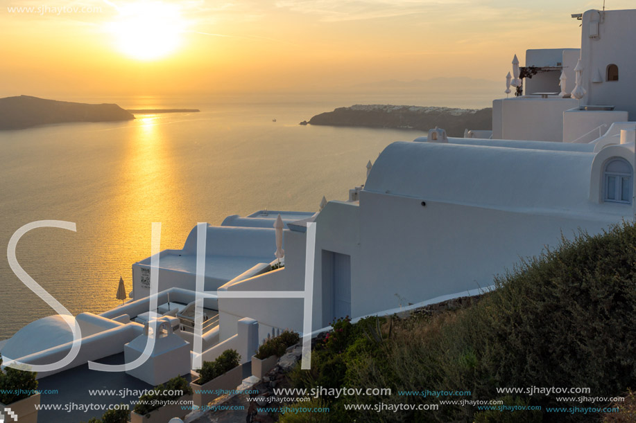 White roof and Amazing sunset in town of Imerovigli, Santorini island, Thira, Cyclades, Greece