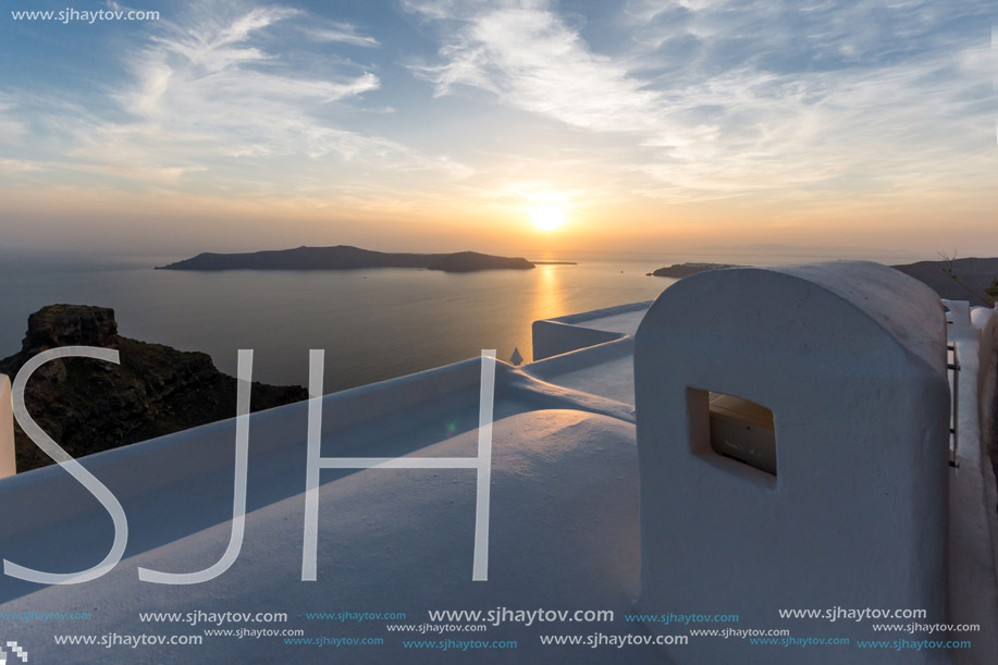 Amazing sunset view from town of Imerovigli to volcano, Santorini island, Thira, Cyclades, Greece