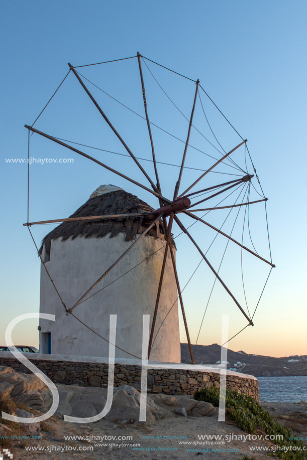 Sunset view of White windmills on the island of Mykonos, Cyclades, Greece