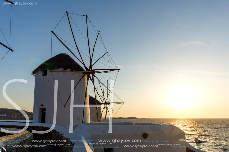 Amazing Sunset and White windmills on the island of Mykonos, Cyclades, Greece