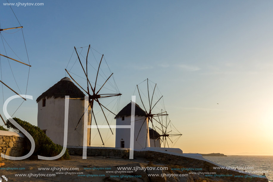 Sunset view of White windmills on the island of Mykonos, Cyclades, Greece