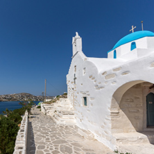 Amazing seascape with White chuch with blue roof in town of Parakia, Paros island, Cyclades, Greece