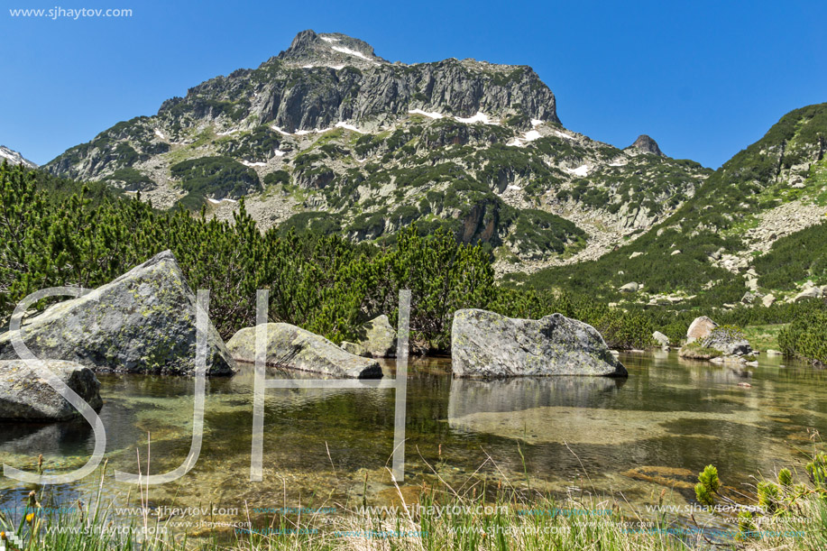 Stones in the water of Banski lakes and  Dzhangal peak, Pirin Mountain, Bulgaria