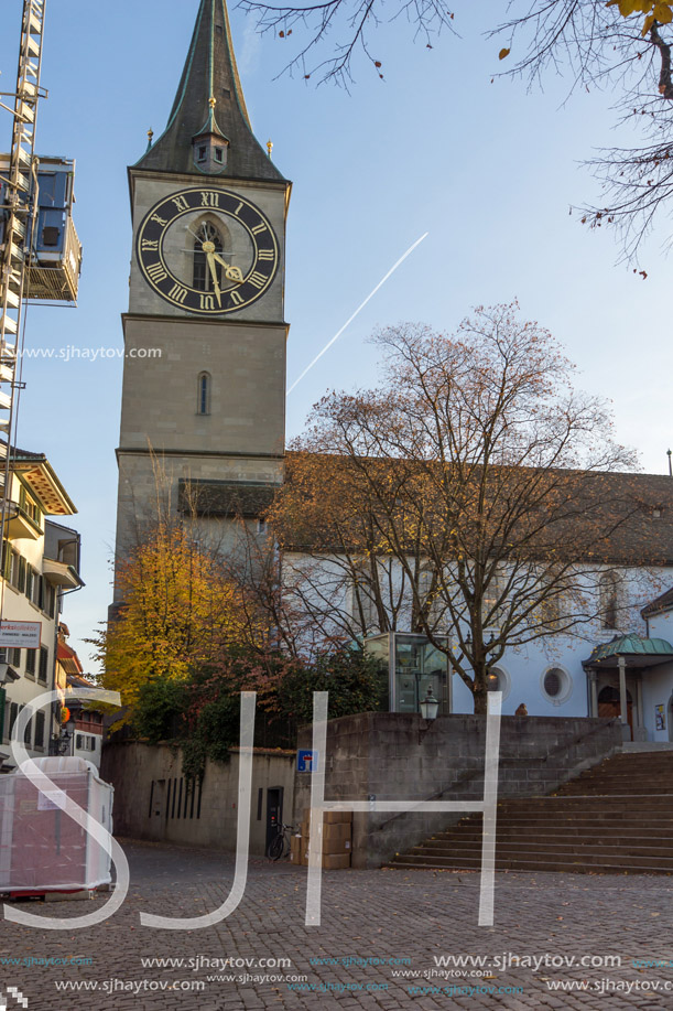 ZURICH, SWITZERLAND - 28 OCTOBER 2015 : St. Peter Church and autumn trees, City of Zurich, Switzerland