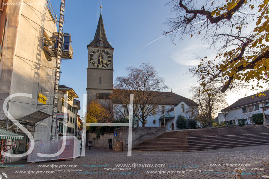 ZURICH, SWITZERLAND - 28 OCTOBER 2015 : St. Peter Church and autumn trees, City of Zurich, Switzerland