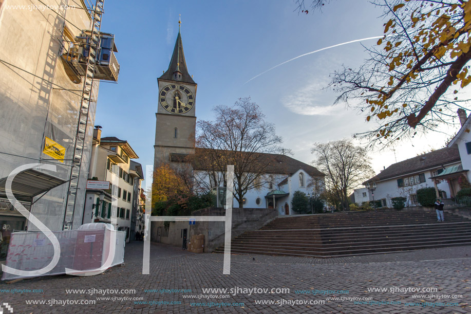 ZURICH, SWITZERLAND - 28 OCTOBER 2015 : St. Peter Church and autumn trees, City of Zurich, Switzerland