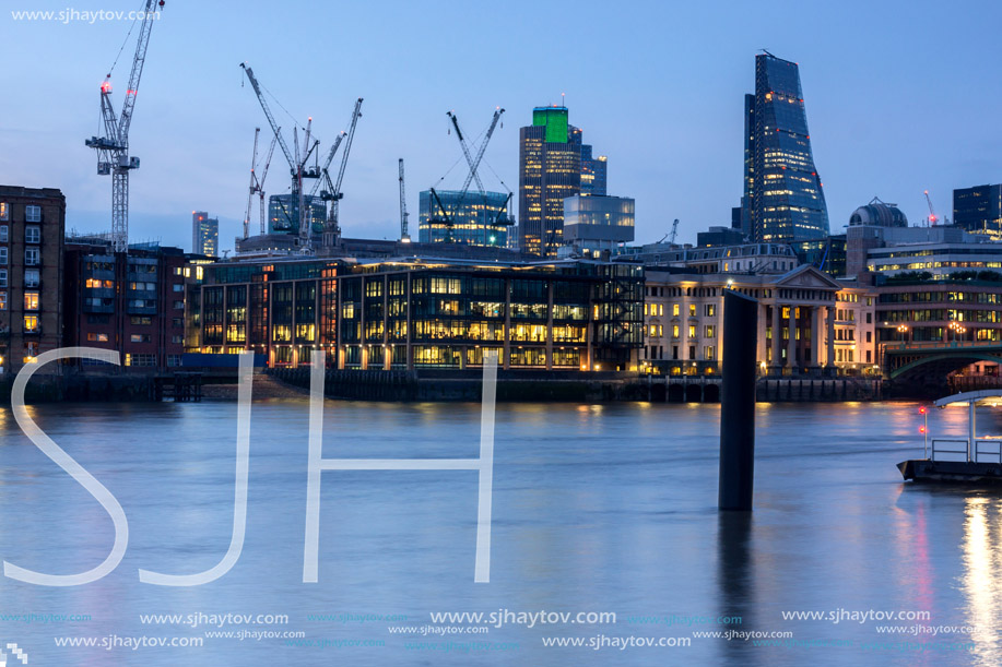 LONDON, ENGLAND - JUNE 17 2016: Night Photo of Thames River and skyscrapers, London, Great Britain