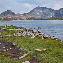 Yellow Sunset over Tevno Lake and Kamenitsa peak, Pirin Mountain, Bulgaria