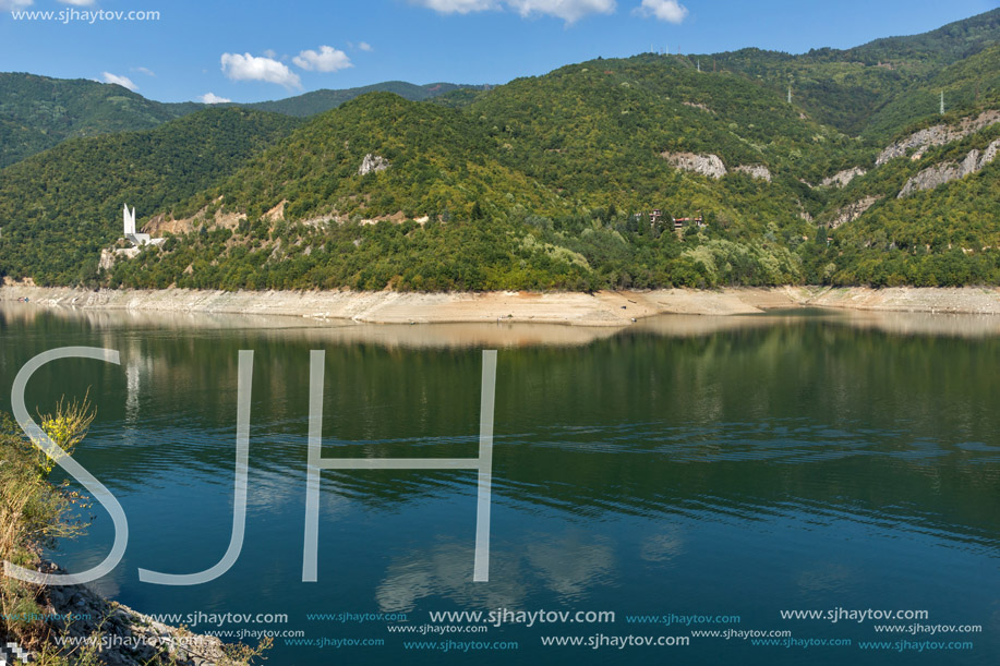 Green forest around Vacha (Antonivanovtsy) Reservoir, Rhodopes Mountain, Bulgaria