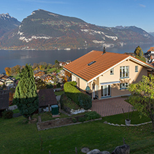 Amazing view of Lake Thun and typical Switzerland village near town of Interlaken, canton of Bern