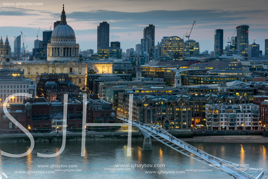 LONDON, ENGLAND - JUNE 18 2016: Night photo of Millennium Bridge, Thames River and  St. Paul Cathedral, London, Great Britain