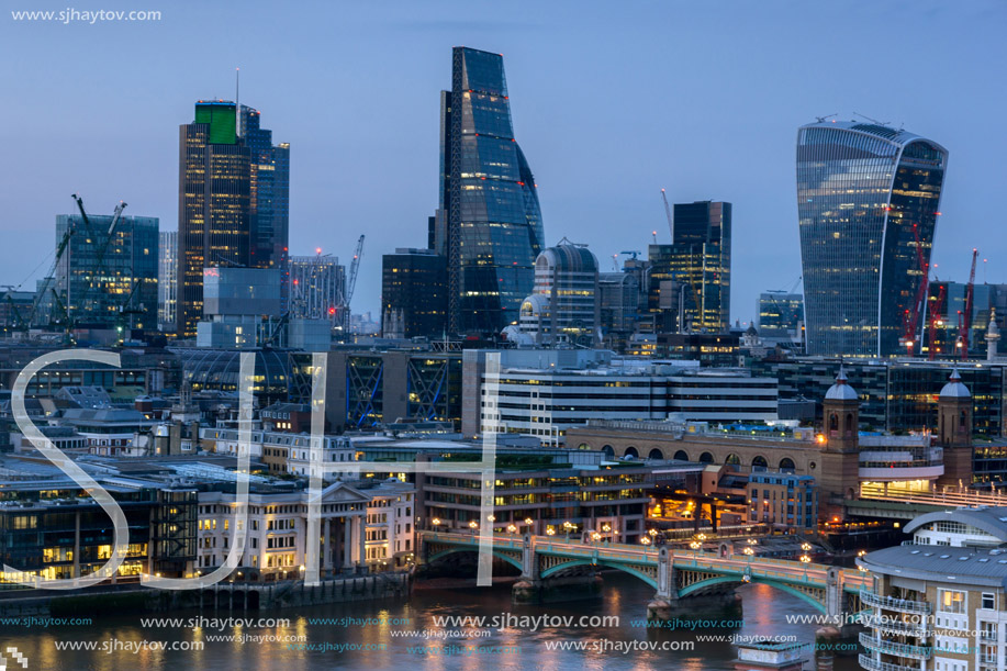 LONDON, ENGLAND - JUNE 18 2016: Night Photo of Thames River and skyscrapers,  London, Great Britain