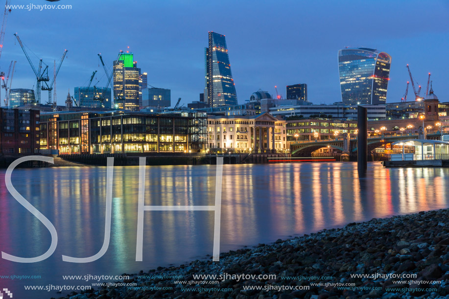LONDON, ENGLAND - JUNE 18 2016: Night Photo of Thames River and skyscrapers,  London, Great Britain