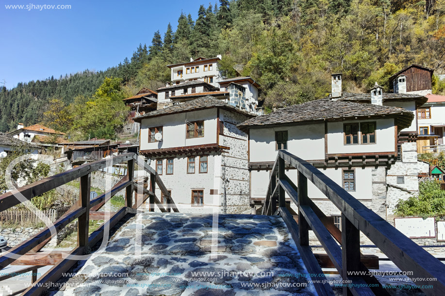 Autumn Landscape with Roman Bridge and old houses in town of Shiroka Laka, Smolyan Region, Bulgaria