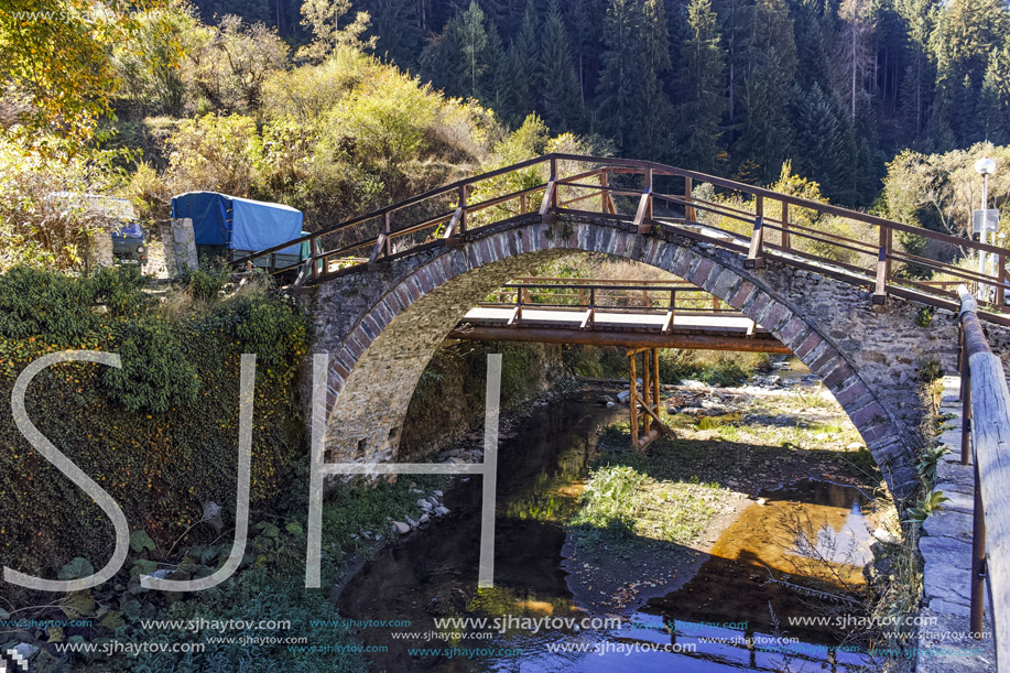 Autumn Landscape with Roman Bridge and old houses in town of Shiroka Laka, Smolyan Region, Bulgaria