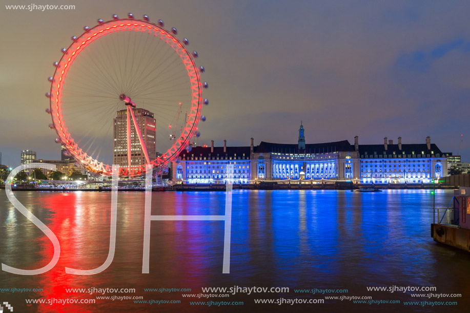 LONDON, ENGLAND - JUNE 16 2016: Night photo of The London Eye and County Hall, London, England, Great Britain