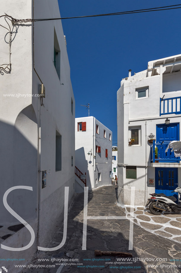 Street with white houses in town of Mykonos, Cyclades Islands, Greece