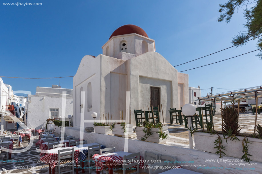 White orthodox church and small bell tower in Mykonos, Cyclades Islands, Greece