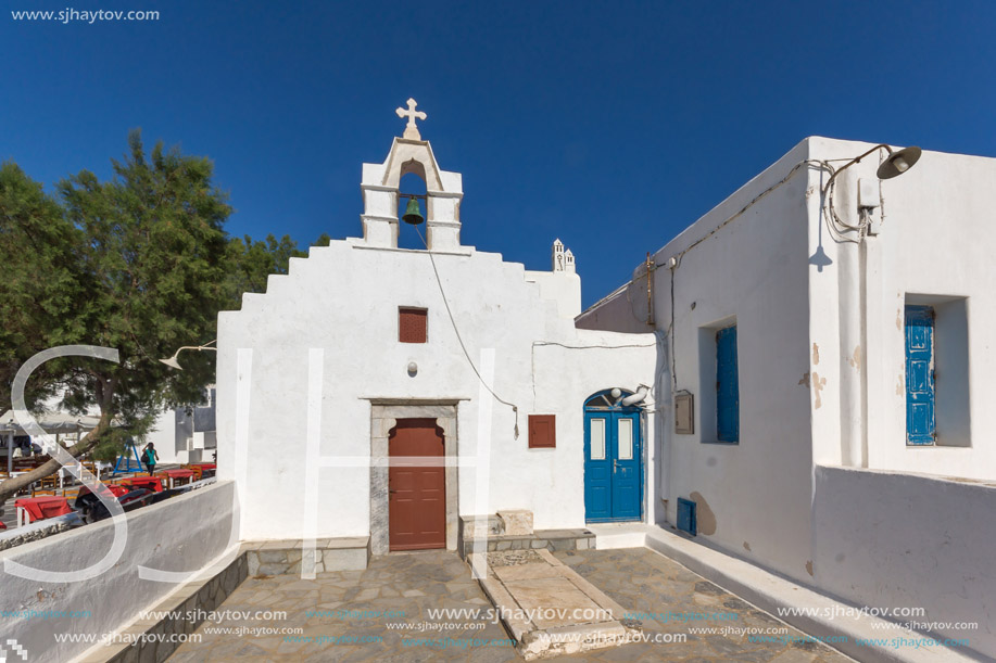 White orthodox church and small bell tower in Mykonos, Cyclades Islands, Greece