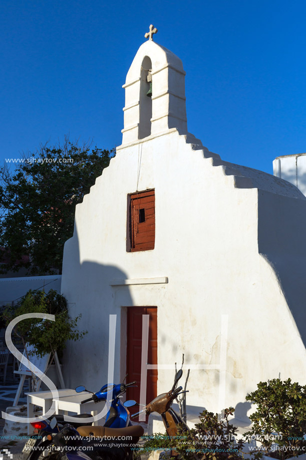 White orthodox church and small bell tower in Mykonos, Cyclades Islands, Greece