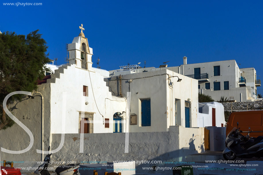 White orthodox church and small bell tower in Mykonos, Cyclades Islands, Greece