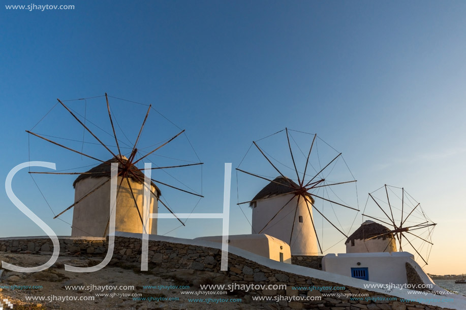 Sunset view of White windmills on the island of Mykonos, Cyclades, Greece