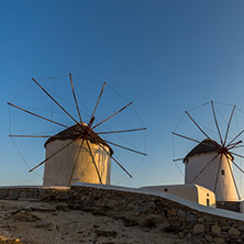 Sunset view of White windmills on the island of Mykonos, Cyclades, Greece