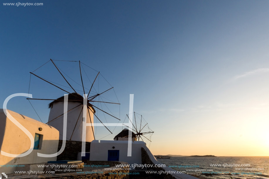 Sunset view of White windmills on the island of Mykonos, Cyclades, Greece