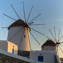 Sunset view of White windmills on the island of Mykonos, Cyclades, Greece