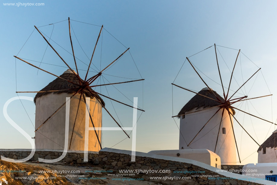 Sunset view of White windmills on the island of Mykonos, Cyclades, Greece