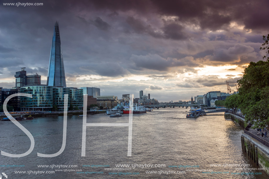 LONDON, ENGLAND - JUNE 15 2016: Sunset Panorama with The Shard skyscraper and Thames river, England, Great Britain