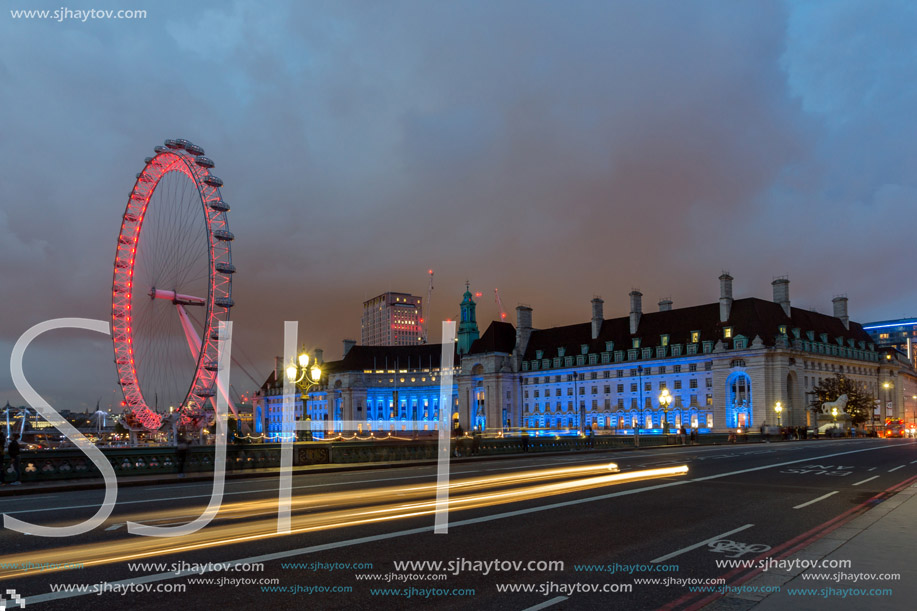 LONDON, ENGLAND - JUNE 16 2016: Night photo of The London Eye and County Hall from Westminster bridge, London, England, Great Britain