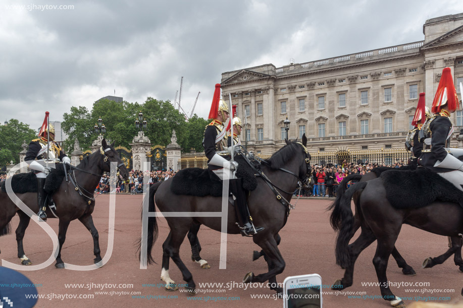 LONDON, ENGLAND - JUNE 17 2016: British Royal guards perform the Changing of the Guard in Buckingham Palace, London, England, Great Britain