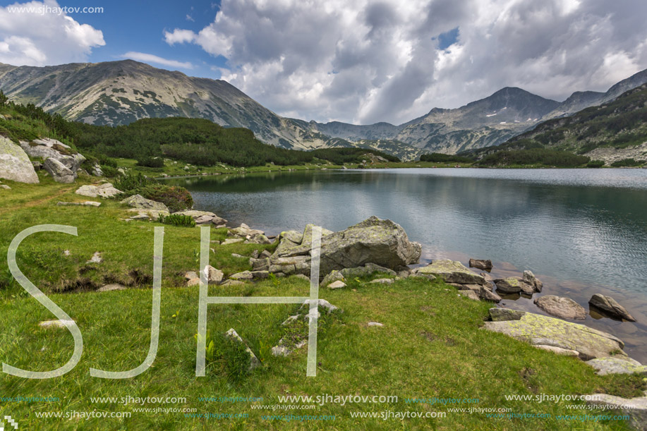 Panorama of Banderishki Chukar and Todorka Peaks and reflection in Muratovo lake, Pirin Mountain, Bulgaria