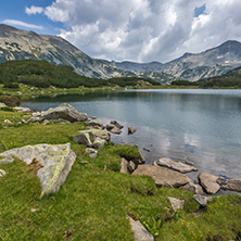 Panorama of Banderishki Chukar and Todorka Peaks and reflection in Muratovo lake, Pirin Mountain, Bulgaria