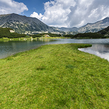 Panorama of Banderishki Chukar and Todorka Peaks and reflection in Muratovo lake, Pirin Mountain, Bulgaria