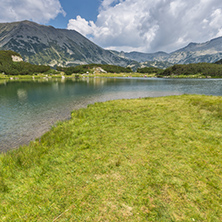 Panorama of Banderishki Chukar and Todorka Peaks and reflection in Muratovo lake, Pirin Mountain, Bulgaria