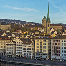 ZURICH, SWITZERLAND - OCTOBER 28, 2015: Reflection of City of Zurich in Limmat River, Switzerland
