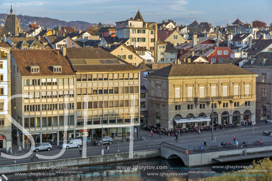 ZURICH, SWITZERLAND - OCTOBER 28, 2015: Reflection of City of Zurich in Limmat River, Switzerland