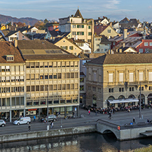 ZURICH, SWITZERLAND - OCTOBER 28, 2015: Reflection of City of Zurich in Limmat River, Switzerland