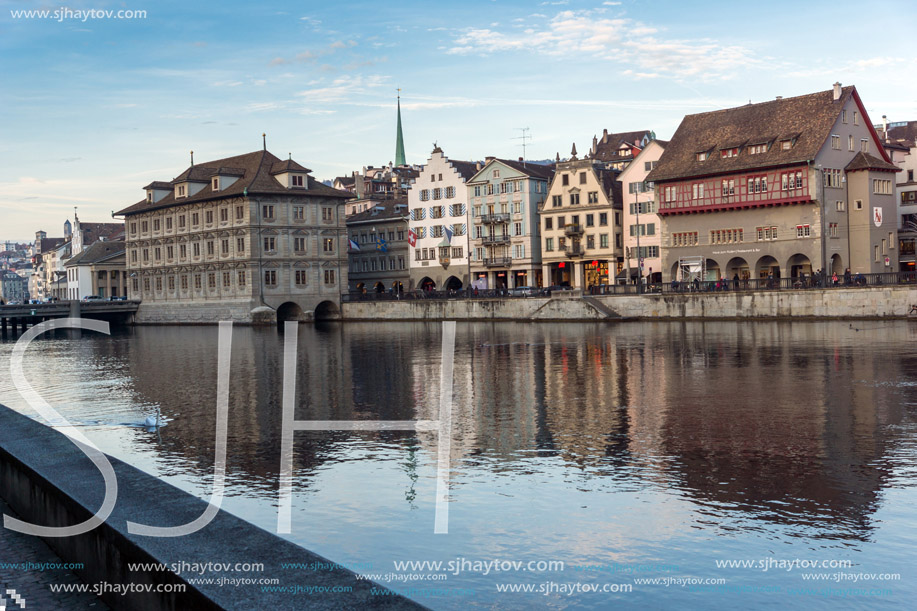 ZURICH, SWITZERLAND - OCTOBER 28, 2015: Reflection of City of Zurich in Limmat River, Switzerland