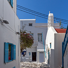 Street with white houses in town of Mykonos, Cyclades Islands, Greece