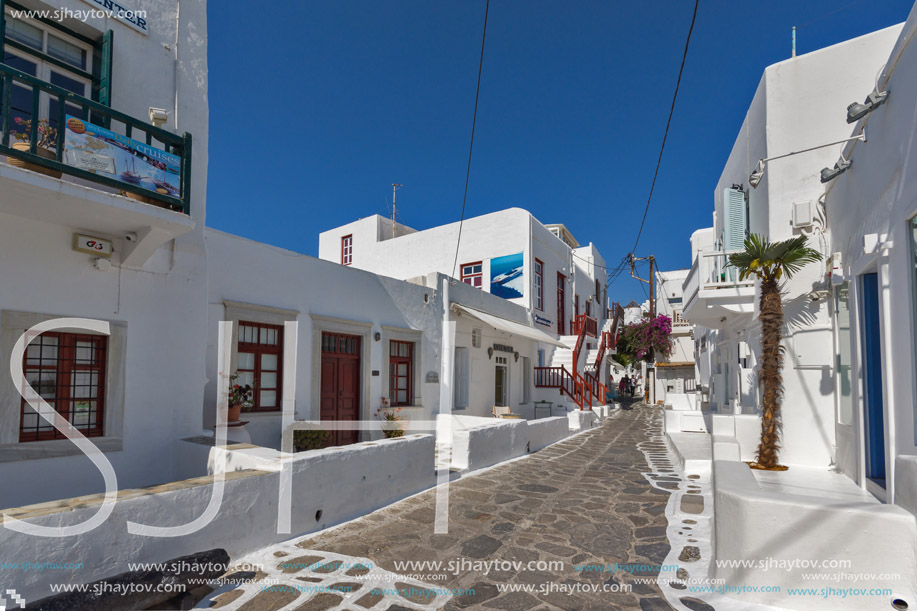 Street with white houses in town of Mykonos, Cyclades Islands, Greece