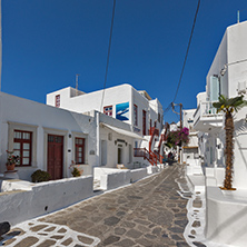 Street with white houses in town of Mykonos, Cyclades Islands, Greece