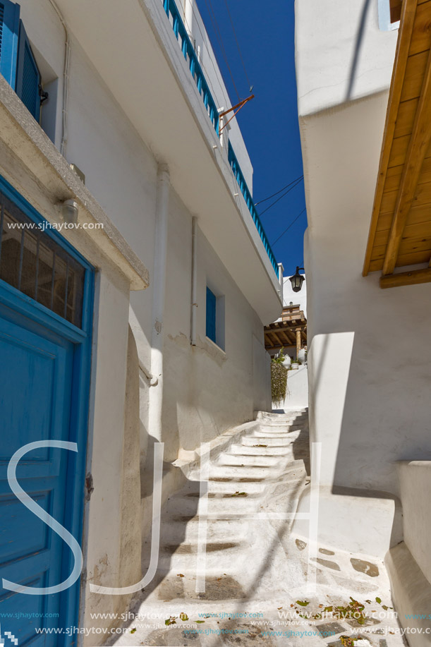 Street with white houses in town of Mykonos, Cyclades Islands, Greece