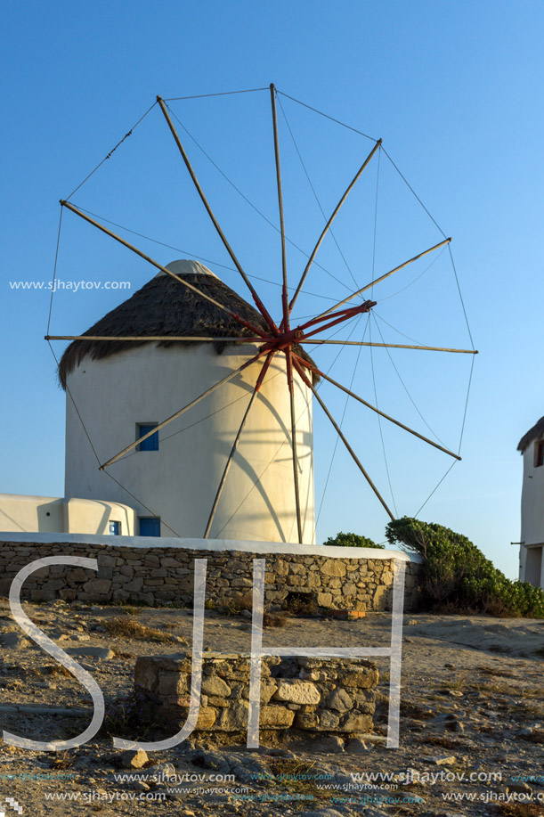 Amazing Sunset and White windmills on the island of Mykonos, Cyclades, Greece