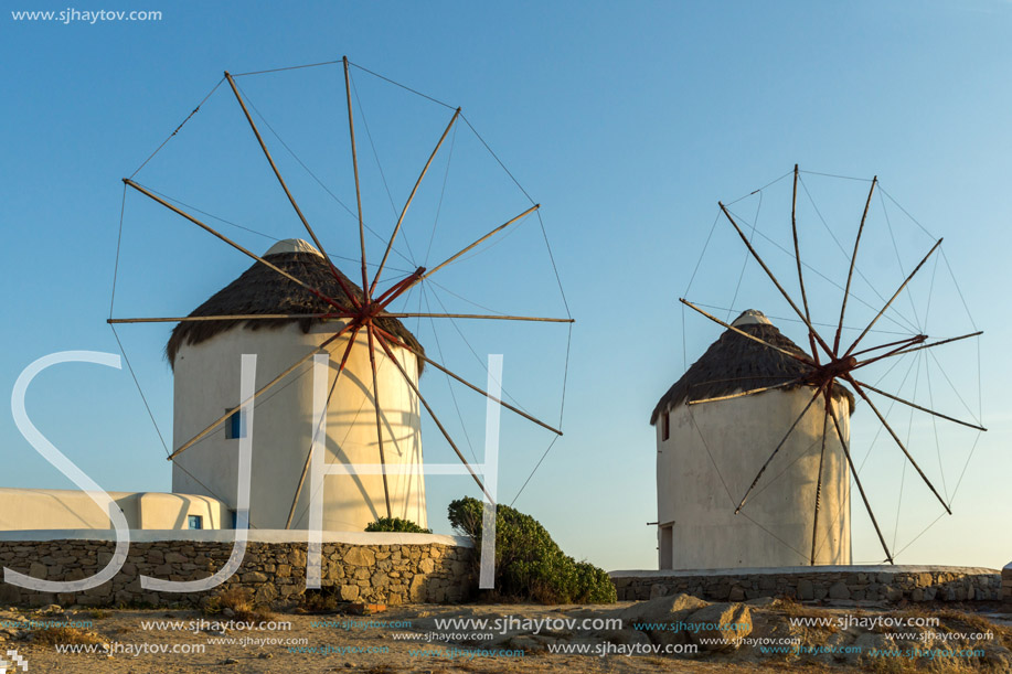 Amazing Sunset and White windmills on the island of Mykonos, Cyclades, Greece