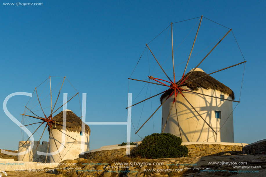 Amazing Sunset and White windmills on the island of Mykonos, Cyclades, Greece